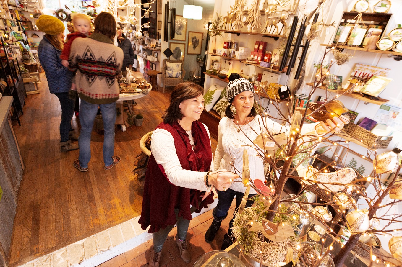 Two women shop for Christmas decorations